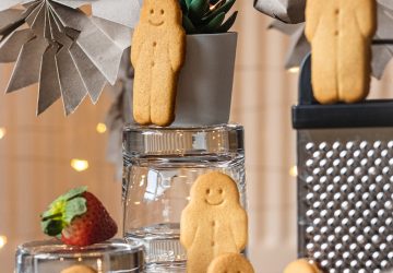 a table topped with cookies and a potted plant